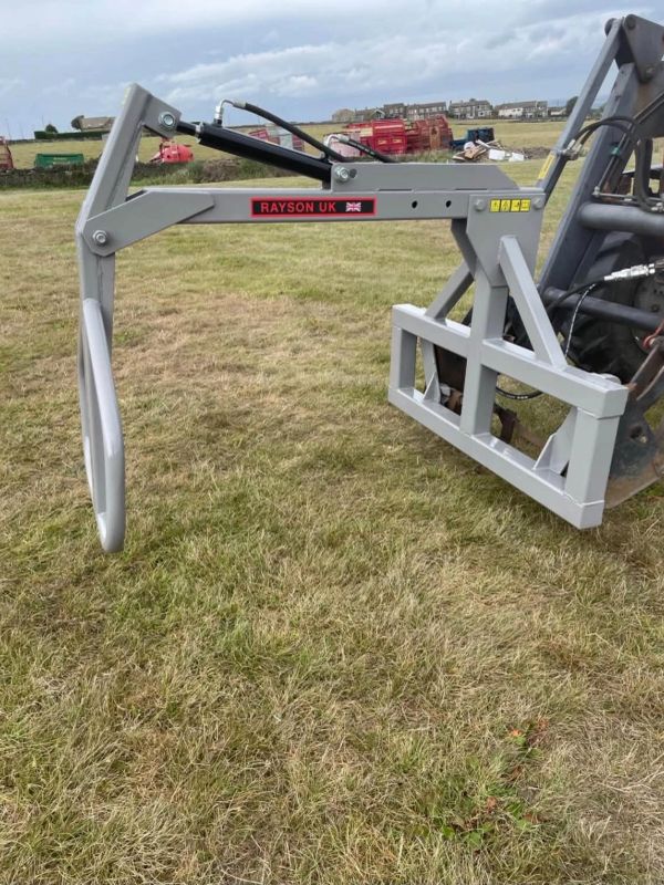 Rayson UK branded farm equipment attachment on grass.