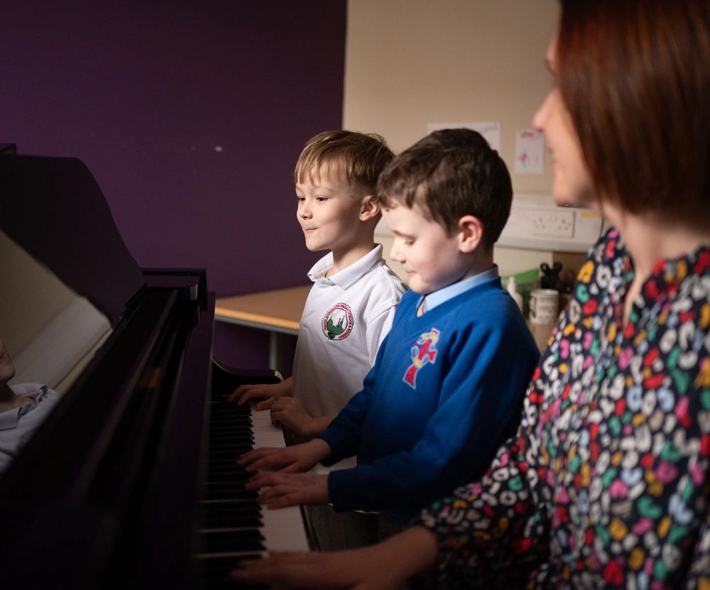 piano lessons two boys and teacher