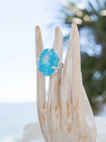 My medium is glass, fine silver, sterling silver and semi precious stones.