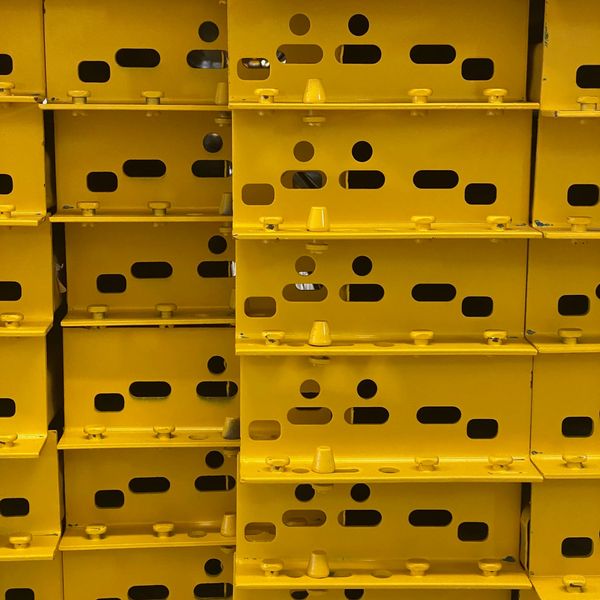 Stacked yellow plastic crates.