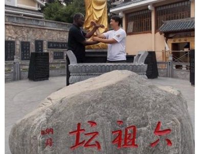 Master Lambert training Chi Sau techniques with Grandmaster Meng at the Southern Shaolin Temple. 