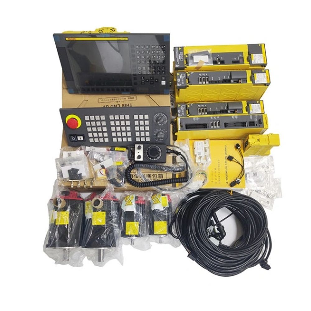 Industrial CNC machine control components including panels, drives, motors, and cables.