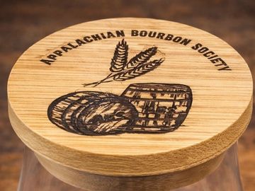 Wooden lid with Appalachian Bourbon Society logo and wheat design.
