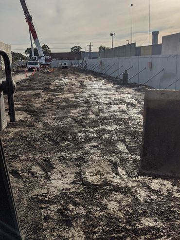 A 14 Tonne Doosan excavator working on a factory site during construction .