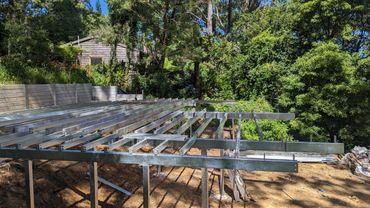 Structural steel under construction on a job site.