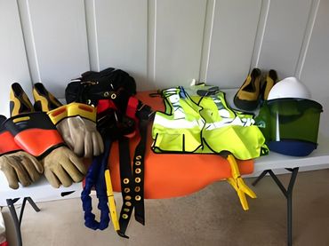 Safety gloves, vests, and helmets.