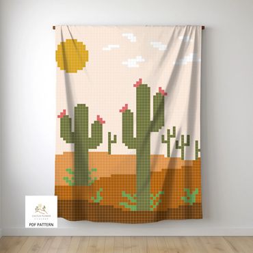 chair throw with multiple saguaro cacti, sun, clouds and plants against a desert background