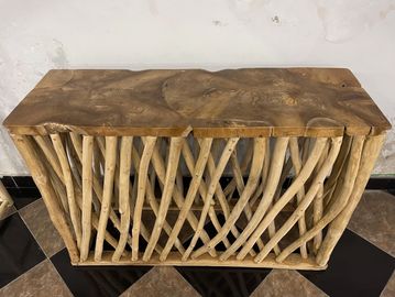 Rustic wooden table with natural log legs and a thick slab top.