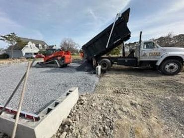 Backfilled and compacted #57 stone inside new foundation.