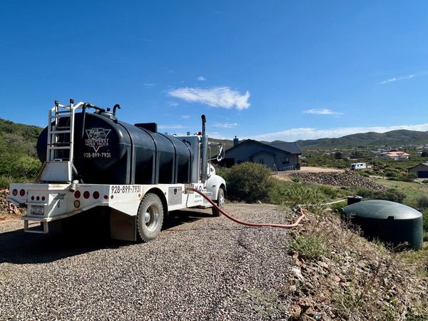 Filling an above ground water tank from above
