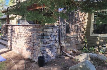 Custom rock work on exterior built-in barbecue with stone countertop!