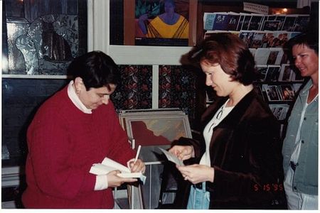 Karla Jay signs books at a book signing.