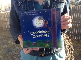 Kids Camping Books Author Loretta Sponsler holding her debut book "Goodnight, Campsite"