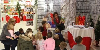 Kids Camping Books Author Loretta Sponsler reading to children at a holiday event