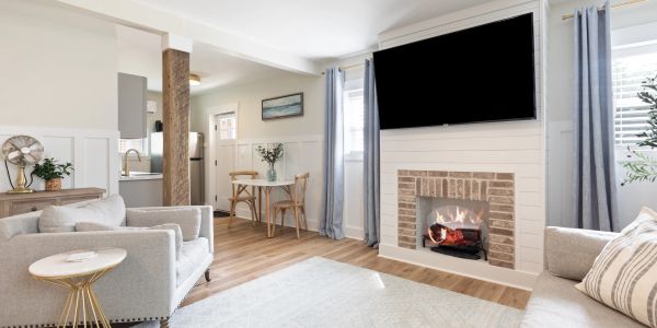 Cozy living room with fireplace and TV.