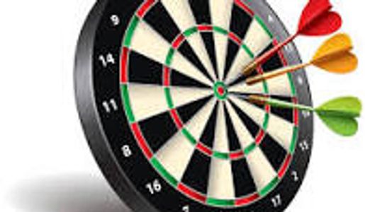 Three darts hitting a dartboard close to the bullseye.