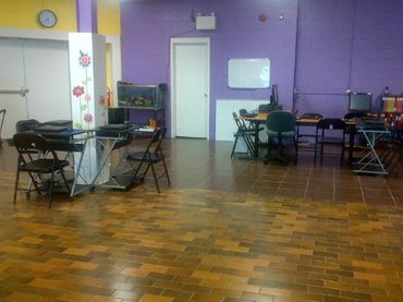 A brightly colored computer room with purple walls.