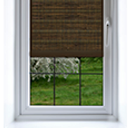 Shade on a window made of blackout fabric showing nothing outside the window.