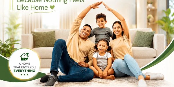 Happy family sitting together at home, promoting Orbis SEZ township.