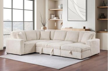 Cream-colored sectional sofa with ribbed fabric in a modern living room.