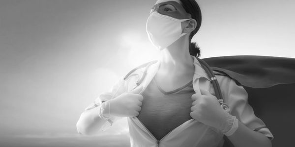 Home Health Care Nurse, represented as a super hero standing stoic with a cape and a sunset