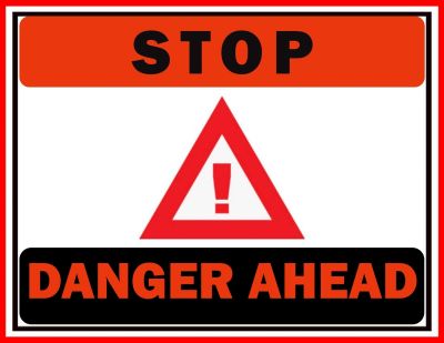 Stop sign with warning of danger ahead.