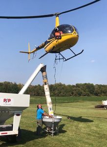 Loading our seed broadcaster from a seed tender