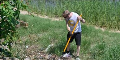 Gary Dusek in shoreline cleanup with Guardians of Flushing Bay