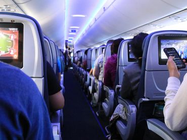 Passengers boarding plane getting ready for take off.