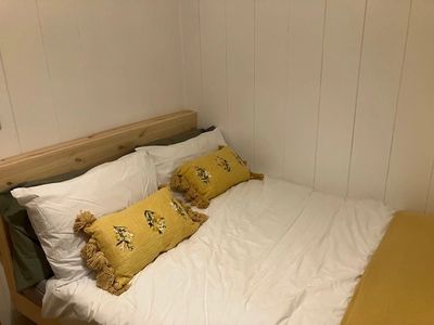 Family glamping bothy interior, double bed, Sherwood Pines Campsite