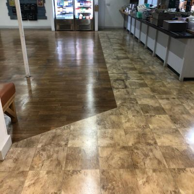 Area with two different types of flooring meeting in a commercial space.