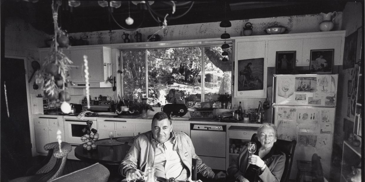 Black and white photograph of M.F.K. Fisher and Bert Greene in her kitchen,