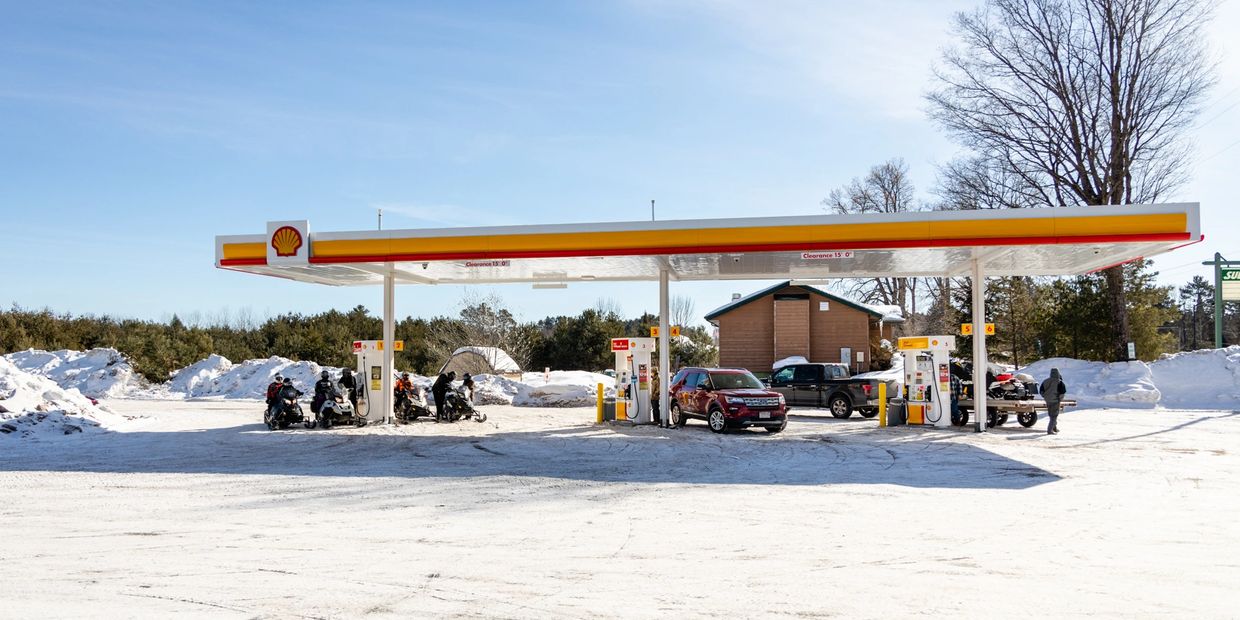 view of a fuel station during the snow season 