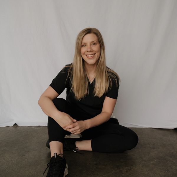 A woman sitting on the floor
