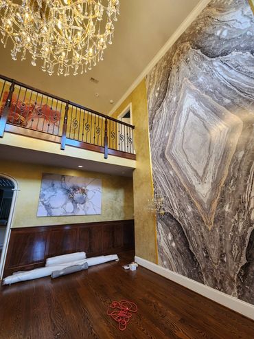 Transform your space with metallic wall finishes, custom artwork, marbling, and wood-grained stairs.