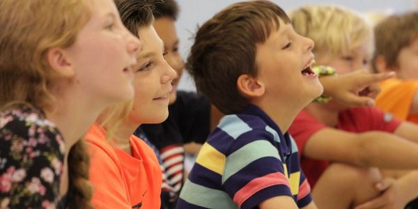a group of children laugh at preschool performer magician Brian Scott
