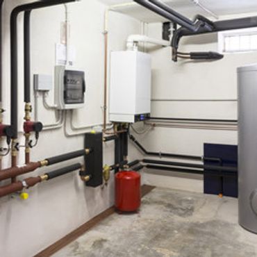 Modern boiler room with pipes, a water heater, and a pressure tank.
