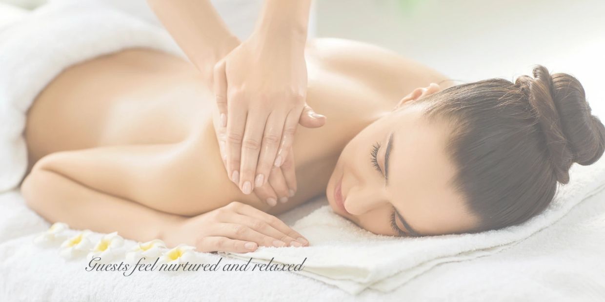 Woman enjoying a relaxing back massage at a spa.