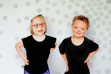 Two GRIT Athletes dancers, posing in their costumes