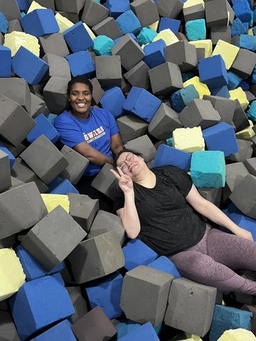 2 participants relaxing in the foam pit