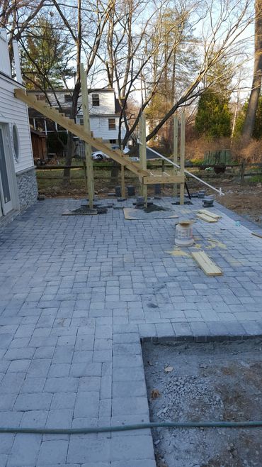 New paver patio next to extension.