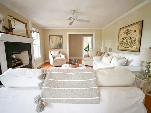 living room real estate staging with furniture, artwork and accessories