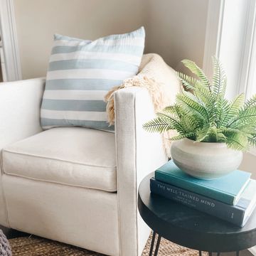 home staging with chair, pillow and decorations