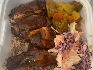 Jerk Chicken, Curry Goat. Coleslaw  and Rice&peas Two meat with any sides.
