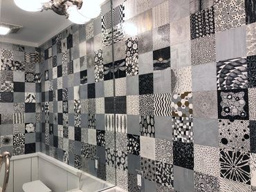 This bathroom was remodeled with 278 individual 5"x 5" pen and ink drawings by Tamara Robertson.