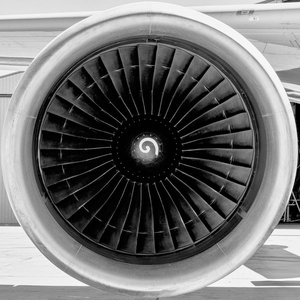 Close-up of an aircraft jet engine turbine commercial aviation art in black and white