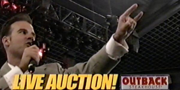 Man hosting a live auction.