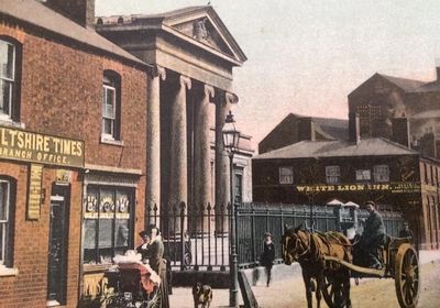 Postcard of the Assize Court with horse and carriage outside. The Wiltshire Times can be seen left.