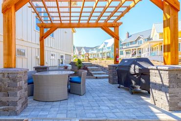 Patio with outdoor dining and 6-burner grill