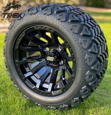 Black rugged off-road tire with shiny black SS rim on grass.